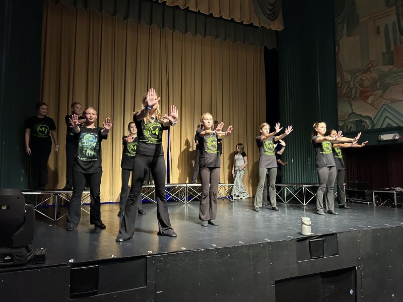Members of the Musical Theatre Ensemble perform during the groundbreaking for the Milton Theatre’s new education wing Oct. 28.