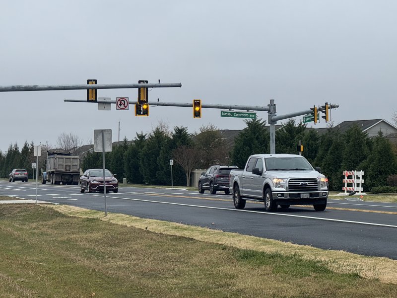 The new traffic signal is in the blinking stage to indicate it will soon be fully operational.