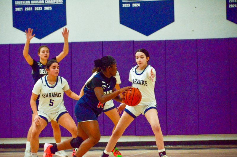 Sussex Academy sophomore Jaelyn Mattingly sticks her hand out on defense.