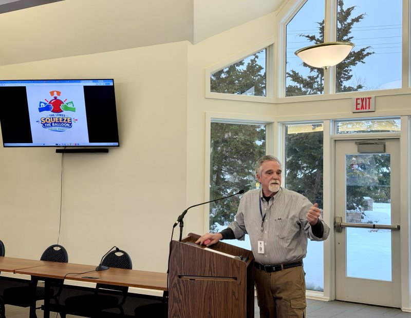 Joe Elder, Lewes city councilman, unveils the logo for the city’s “Squeeze the Balloon” parking program at the Feb. 25 council workshop. Elder is leading a working group that will take a deep dive into the city’s parking problems. Elder said the name references their goal to not squeeze anybody out of a solution, whether it be residents, businesses or visitors. BILL SHULL PHOTO