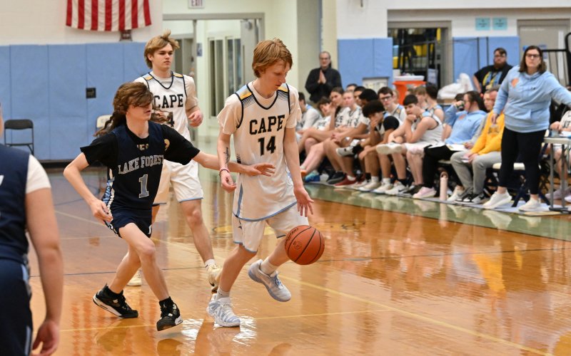 Cape unified partner Bennett Steinmann dribbles the ball up the court.