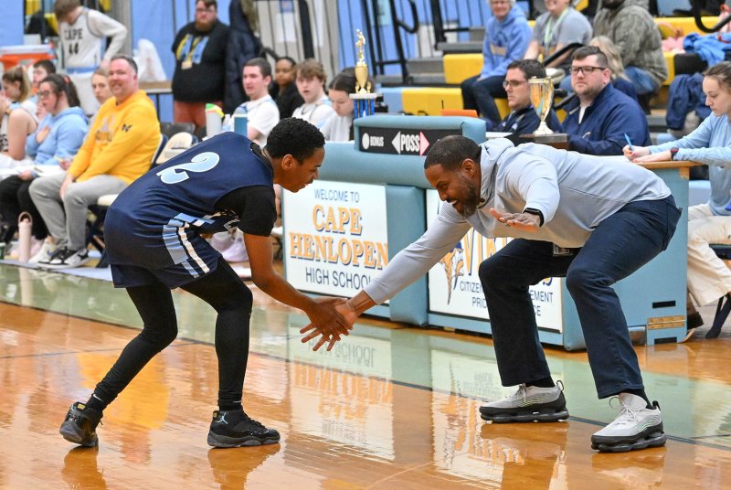 Lake coach Darrell Jones congratulates Aliki Long on a made three.