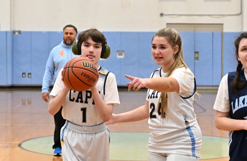 Cape’s Harlan Jones takes a shot with the assist by unified partner Brynne Fox.