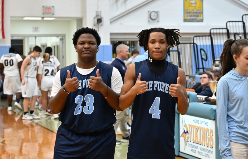 Lake Forest players Barack Johnson, left, and Moreghan Morris give the game a thumb’s up.