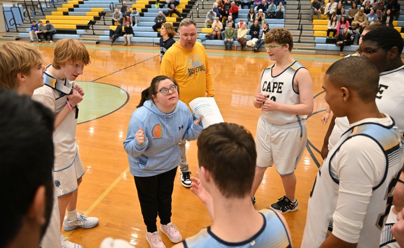 Cape assistant coach Sara Davis speaks with her players during a time-out.