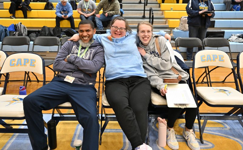 Cape coaches Tom Rushin, Sara Davis and Elle Nauman share a moment on the bench.