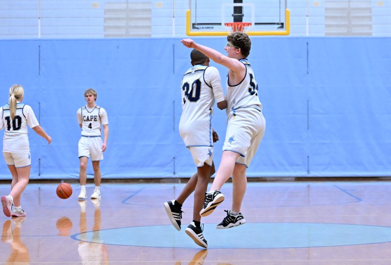 Cape’s Robert Harman-Strike, right, gets a chest bump from teammate Zane Richardson.