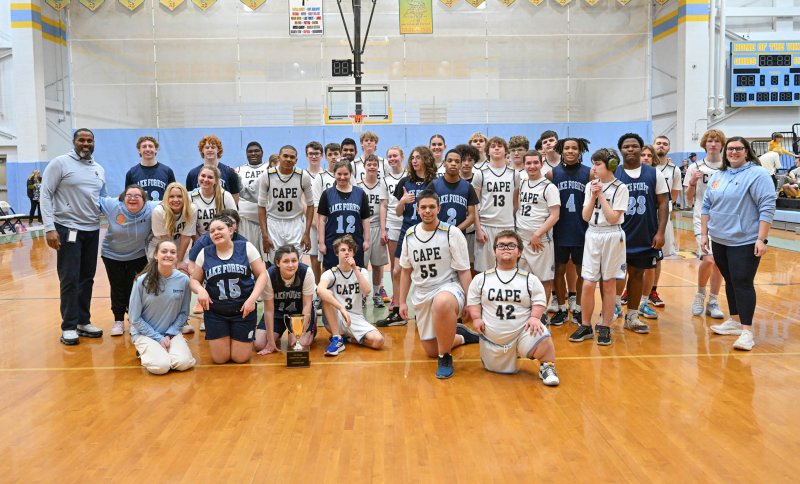 The Cape and Lake Forest unified basketball teams finished their seasons with a 67-67 tie. Shown are the teams as they congratulate each other on a great and unifying game. DAN COOK PHOTOS