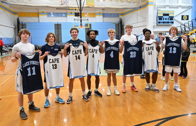 The two teams trade game jerseys.