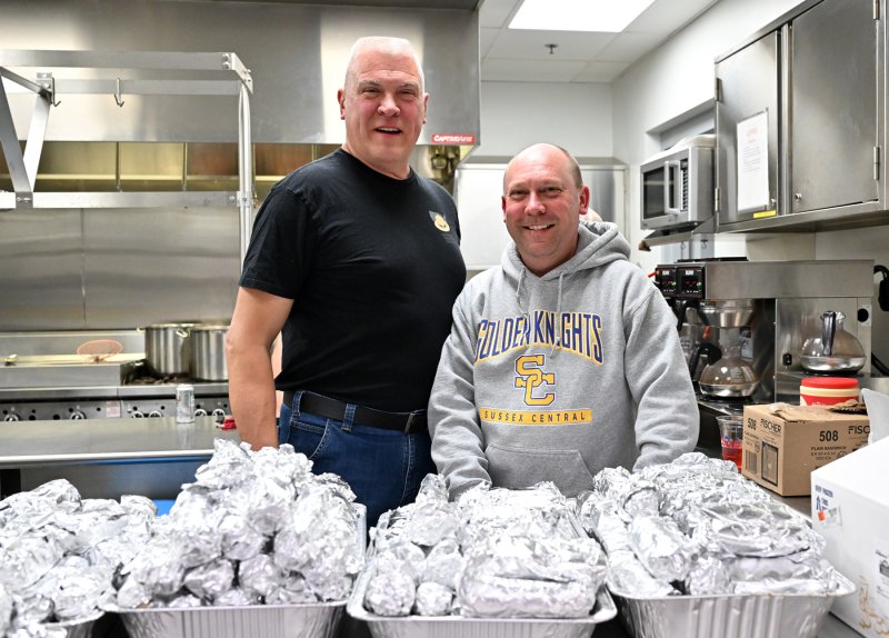 Working the hot dog booth are retired Delaware State Trooper Lad Dick and Delaware State Trooper Lewis Briggs III.