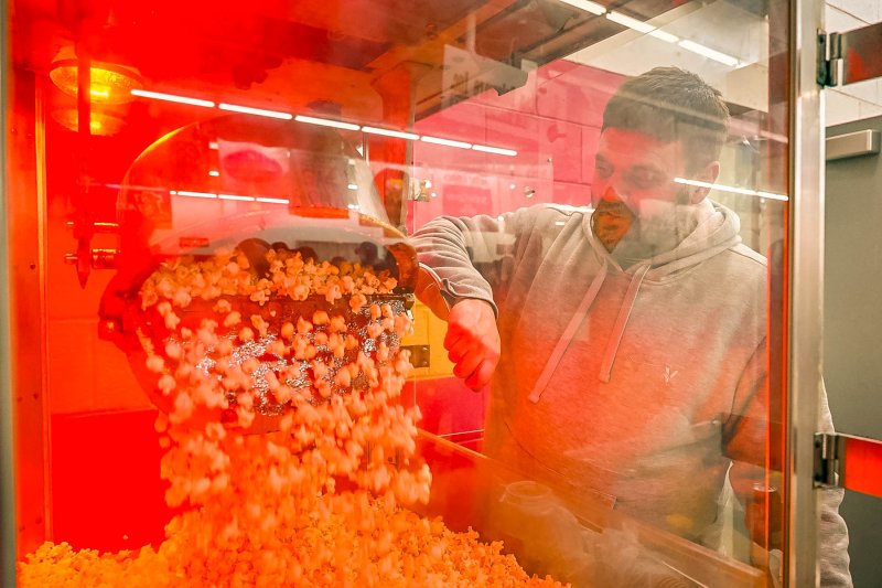 Ricky Hudson handles the popcorn maker for the event.