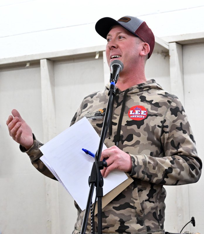 Michael Briggs, president of the Georgetown Fire Company, speaks with the volunteers before the doors open.