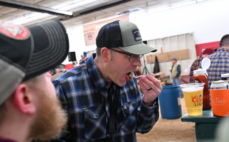 Robert Quirk enjoys a shucked bivalve mollusk.