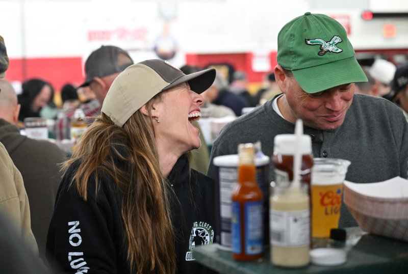 Having a laugh and a oyster are Jennifer Myers and her brother Greg.