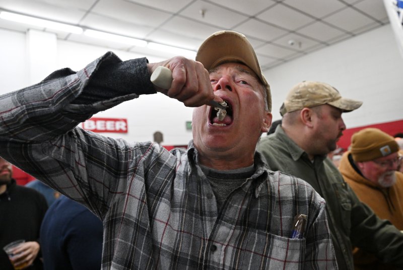 Bill Messick slurps one down.