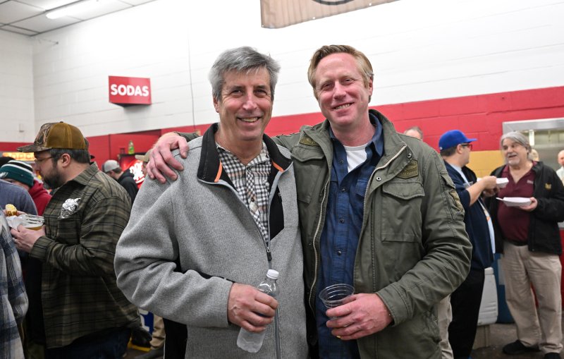 Father and son Marc, left, and Jason Fruchtman attend the even teach year.