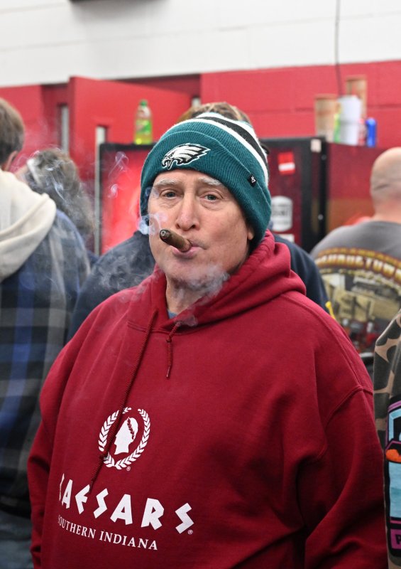 Enjoying a stogie is Nicholas Caggiano Jr.