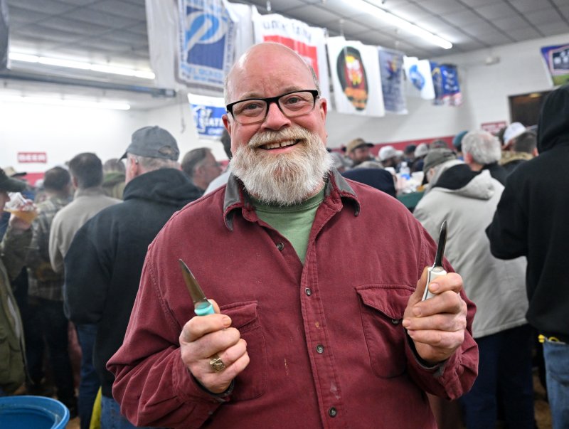 Local John Souder displays his shucking knives. He is a veteran of numerous Oyster Eats.