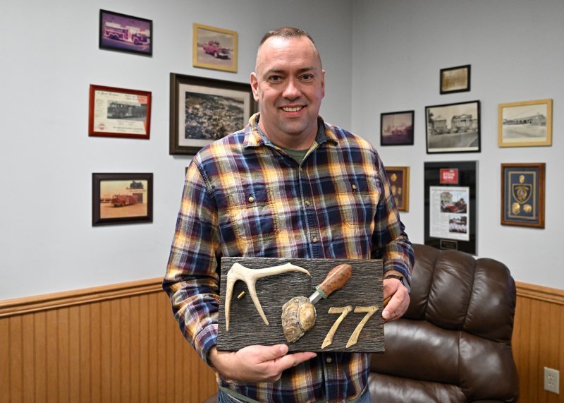 Sen. Brian Pettyjohn, R-Georgetown, holds the knife to be auctioned at the event. The knife was made by father-and-son team of Rocky and Neal Greene.