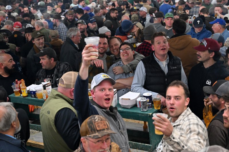 Ben McCall, left, and Mark Cirillo raise a toast to the band