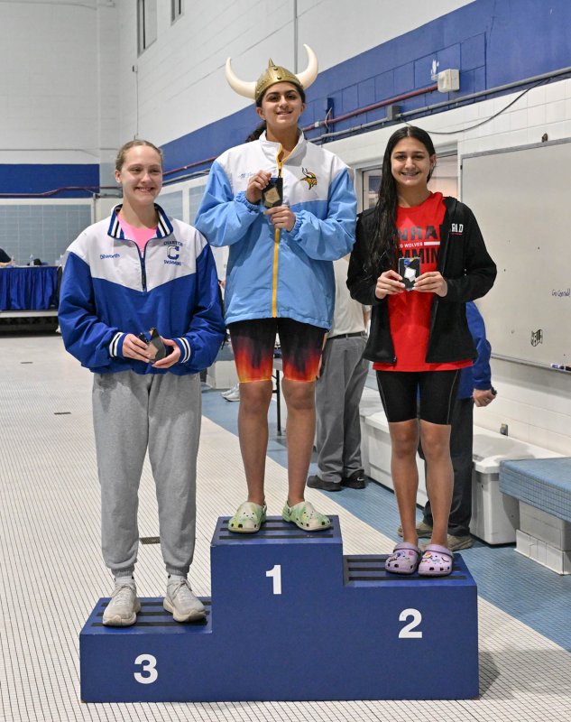 Cape junior Mia Jaoude stands tall in the first-place spot on the podium as Anna Karanjia from Conrad is second and Abby Dilworth from Charter in third.