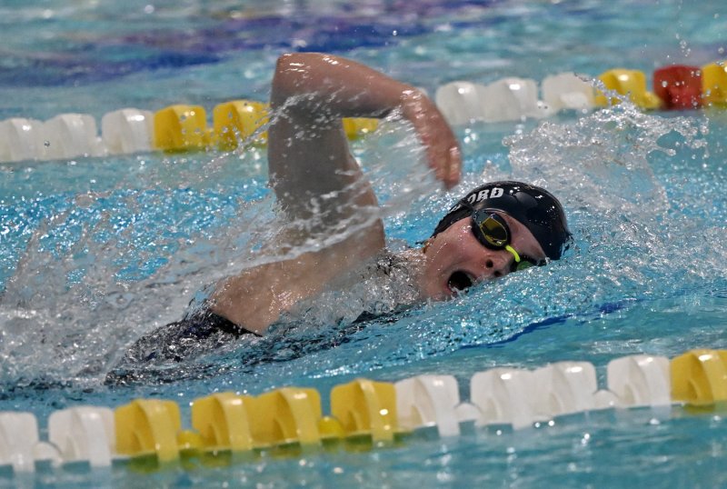 Sussex Academy junior Anna Mumford swims to first in the 500 free.