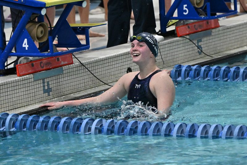 Sussex Academy junior Anna Mumford has a big smile as she looks at her time in the 500 free.