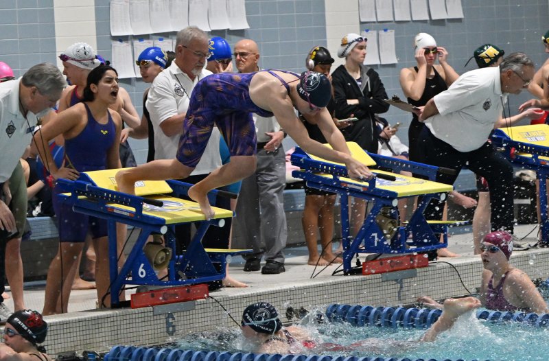 Sussex Academy’s Samantha Petty leaves the blocks in the 200 free relay.
