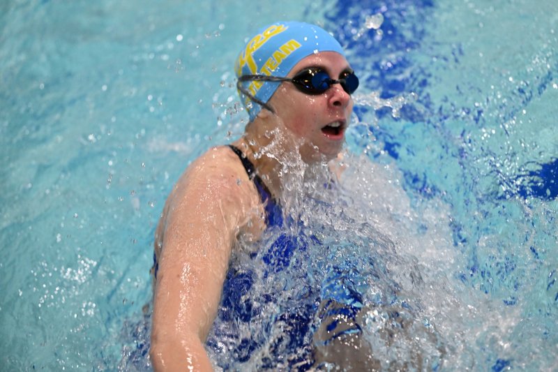 Cape’s Zoey Neufeld makes the turn in the 100 breaststroke.