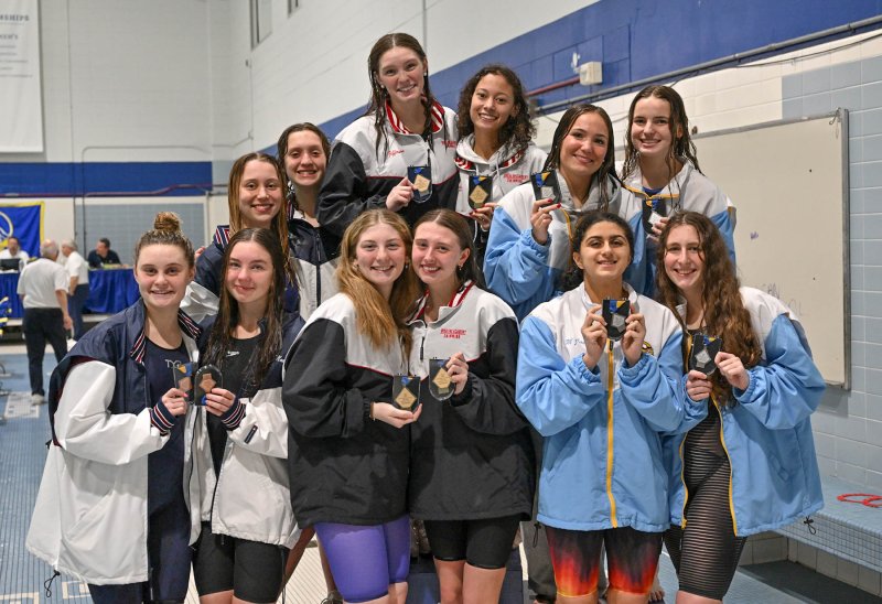 The Cape 400 free relay team of Sidney Caldwell, Isla Touw, Mia Jaoude and Hayden Hazzard stands on the second-place podium tier. Ursuline took first, with Wilmington Friends placing third.
