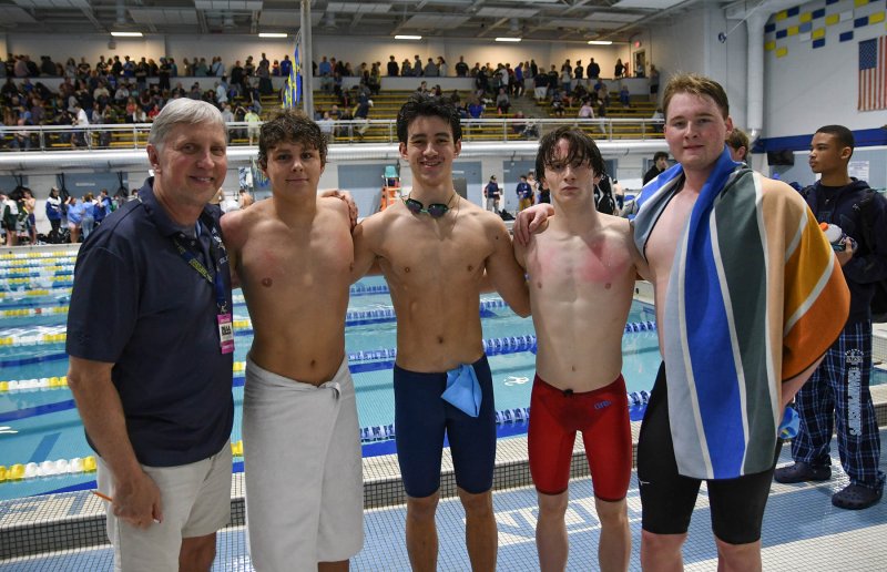 The Cape 400 free relay team stands with Cape coach Bill Geppert. Shown are (l-r) Geppert, Eli Oliver, Brooks Leonhartt, Jack Bain and Cole Huxtable. DAN COOK PHOTOS