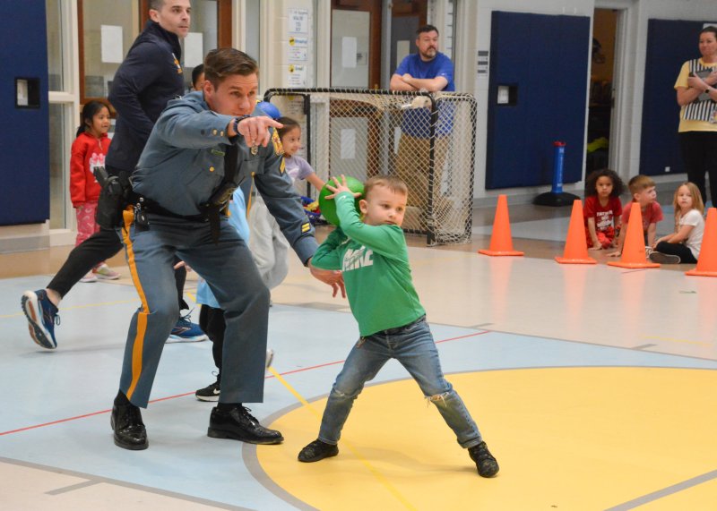 Delaware State Police Cpl. Cullen Fulton helps Milton Elementary kindergartener Owen DeMalto pick out which staff member to target with his dodgeball. SUBMITTED PHOTOS