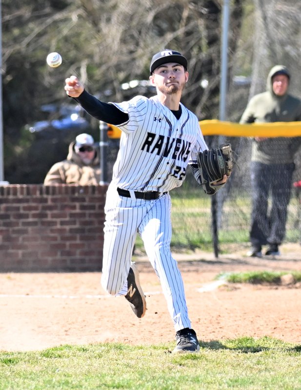 Ravens senior Logan Micinowski throws out a runner.