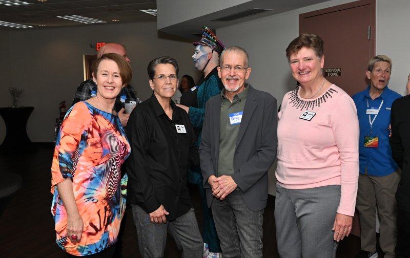At the meet-and-greet are (l-r) comedian Mina Hartong, Teri Seaton, CAMP Rehoboth founder Murray Archibald and Leslie Ledogar.