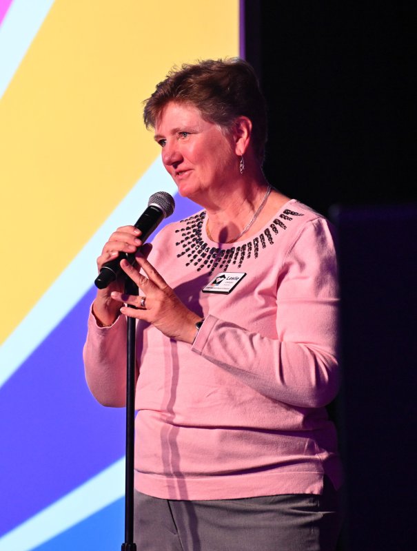 CAMP Rehoboth Board of Directors President Leslie Ledogar welcomes the crowd to the event and introduces the new Executive Director, Dr. Robin Brennan.