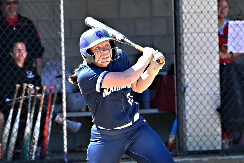 Junior second base Grayce Glover slams a shot to right field.