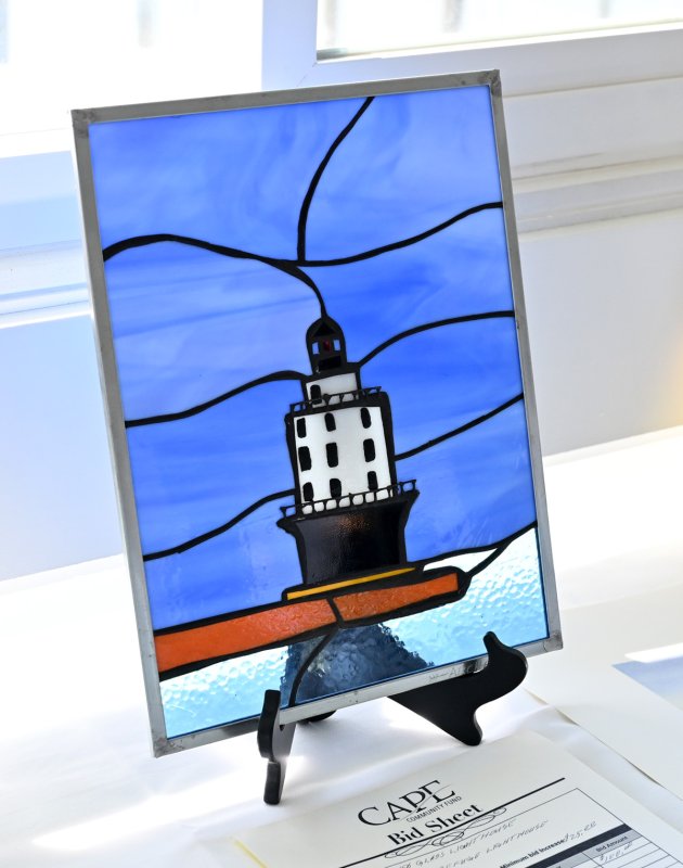 Cape Community Fund Chair Butch Archer made and donated this sun catcher of the Harbor of Refuge Lighthouse.