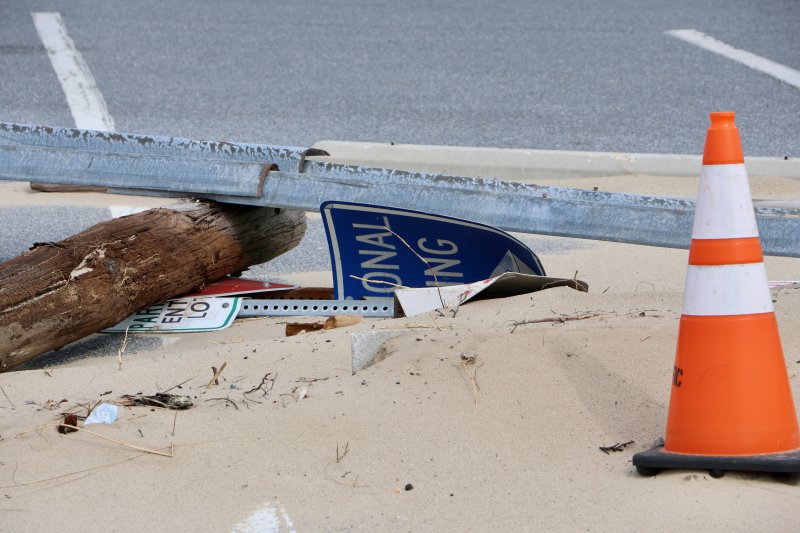 Road signs, some that appear to be damaged, lay in the middle of the Savannah Beach parking lot. Ellen Lorraine McCabe, city manager, said city maintenance staff piled them there and will reinstall them.