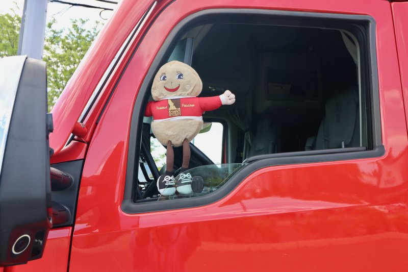A stuffed Spuddy Buddy doll hangs from the driver’s window. The truck was heading to the commissioning ceremony for the submarine USS Idaho in Groton, Conn.