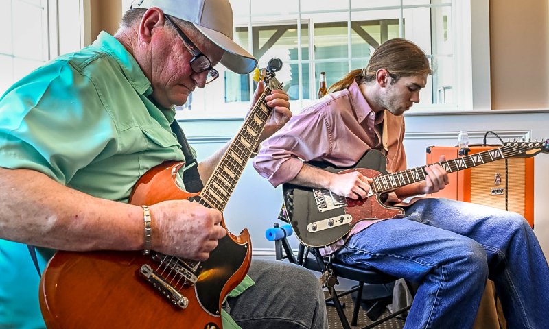 The Guitar Guys aka Nelson Pennypacker, left, and Will Bragg, entertain the crowd during the band changeover.