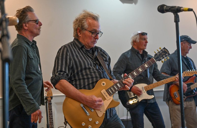 Funsters lead guitarist Keith Mack plays a solo during “Smooth.”