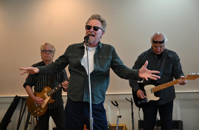 Funsters lead singer Sherman Ward wails out a tune while the brothers Keith, left, and Greg Mack accompany him.