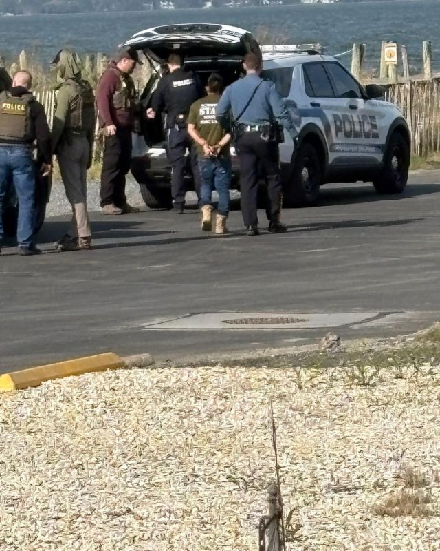 Federal ICE agents detain two people in Dewey Beach on the morning of April 22.