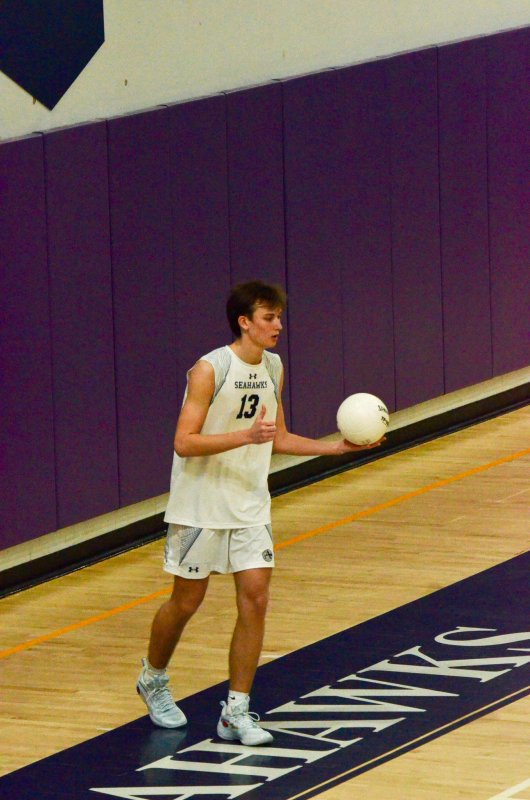 Seahawks junior Mack Lawson begins to spin the ball before his serve.