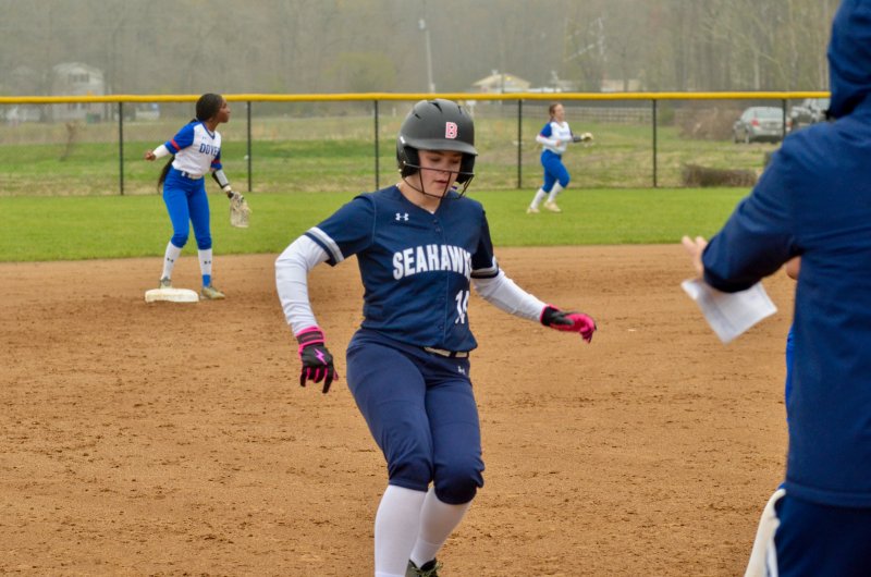 Sussex Academy eighth-grader Bailey LeCates rolls into third base.