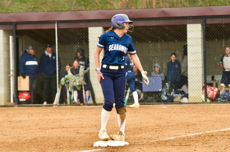 Seahawks sophomore Teagan Forester looks for her coach as she stands on third base.