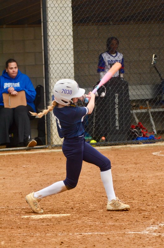 Sussex Academy eighth-grader Aubrey Campanese record her first varsity hit in the cold with no batting gloves.