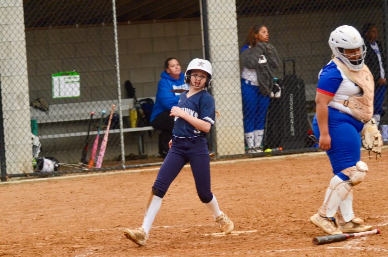 Sussex Academy eighth-grader scored when her sister Marley singled.