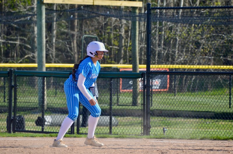 Vikings sophomore Mia Scott dances on first.