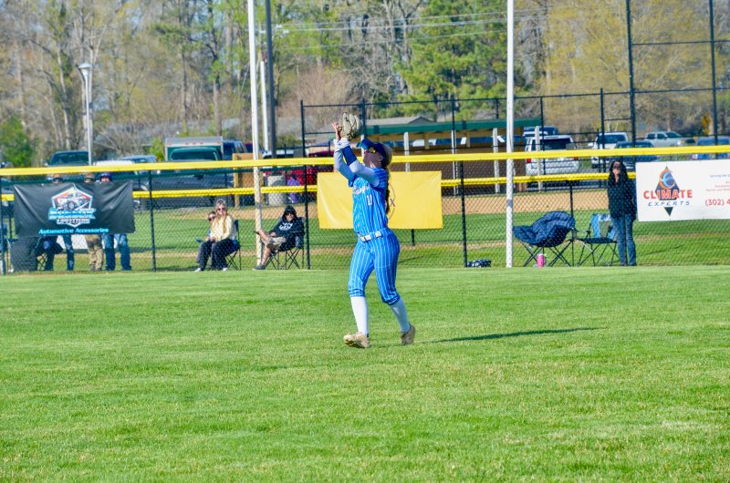 Cape senior Alivia Longo watches the ball into her glove with two hands.